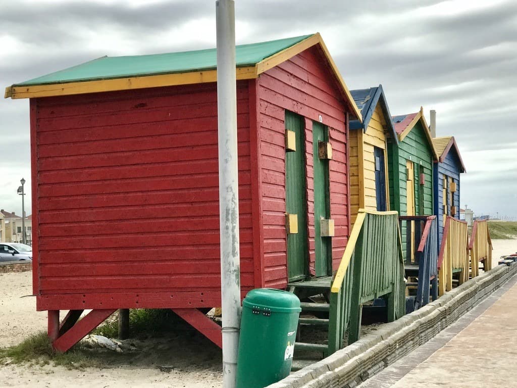Brightly painted beach huts