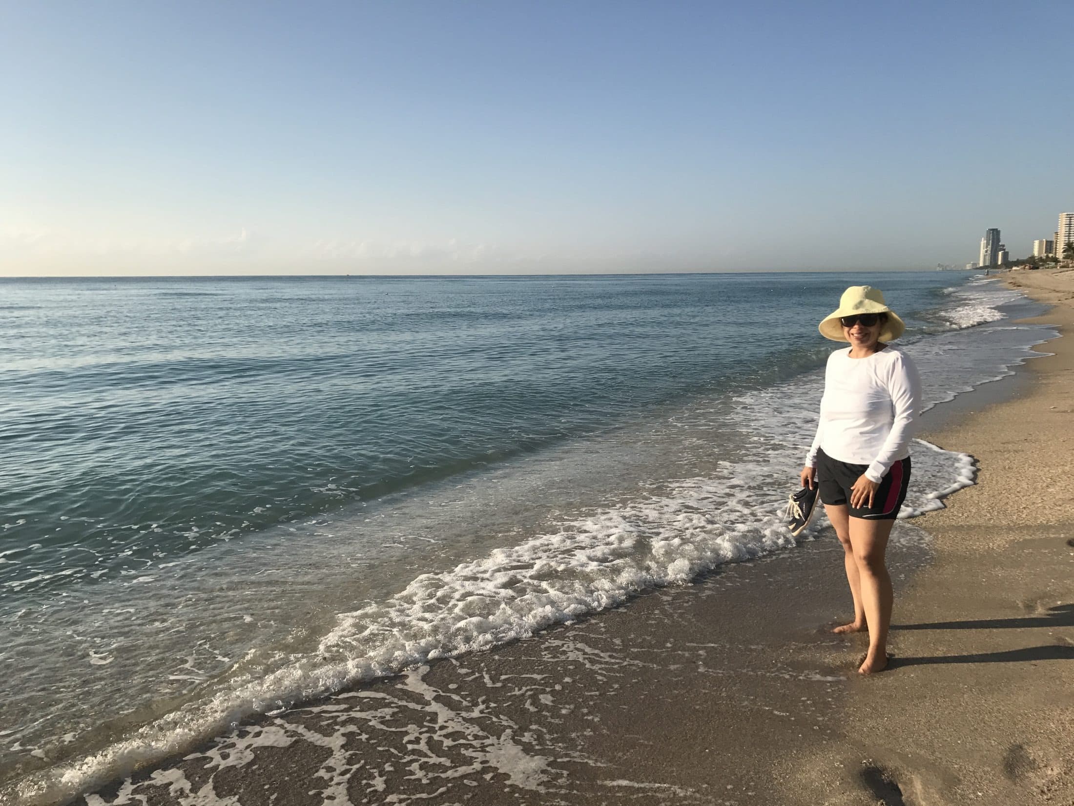 Mamata walking along the shoreline in the morning