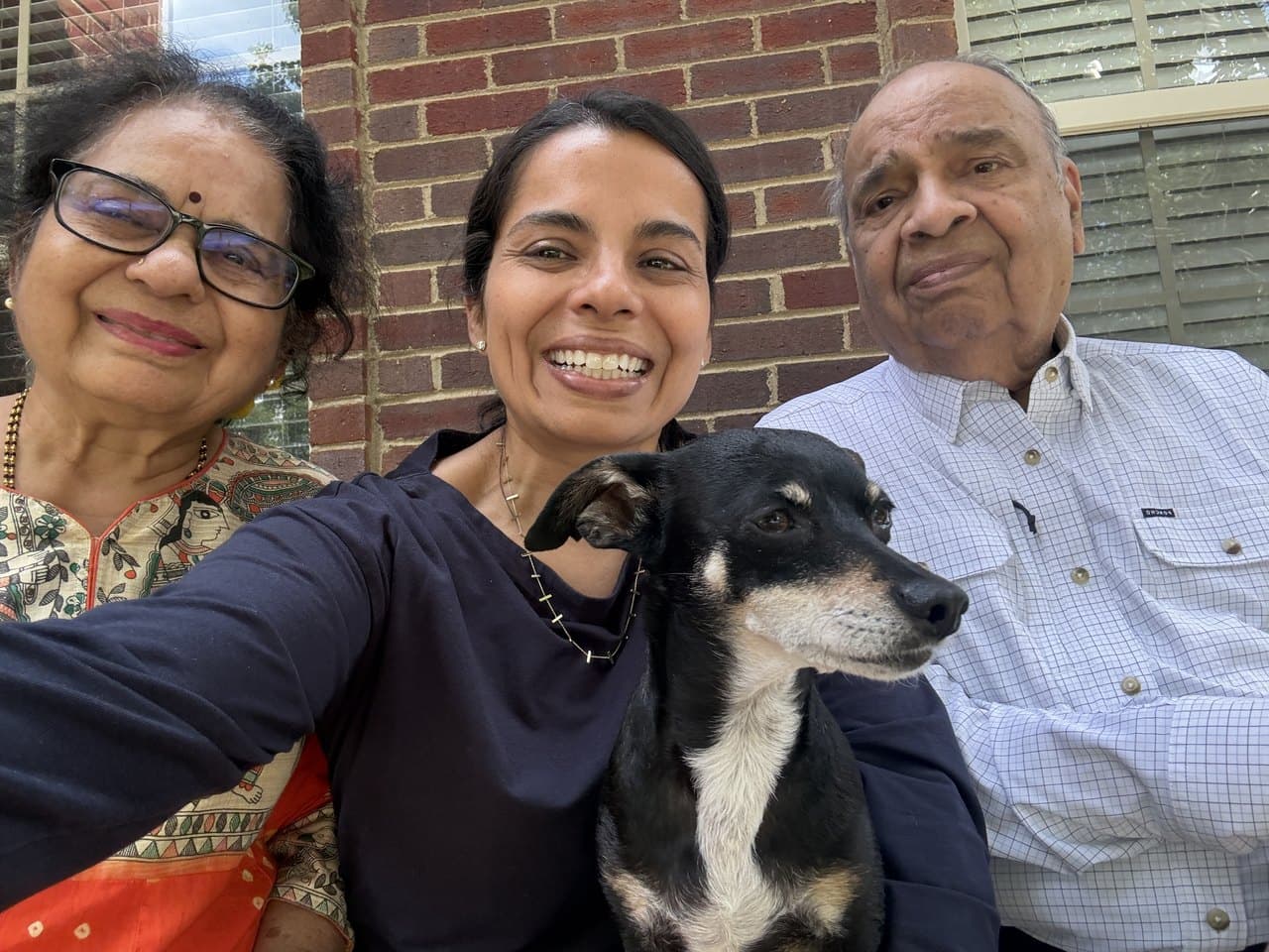 Mamata with her mother, her father and the family dog