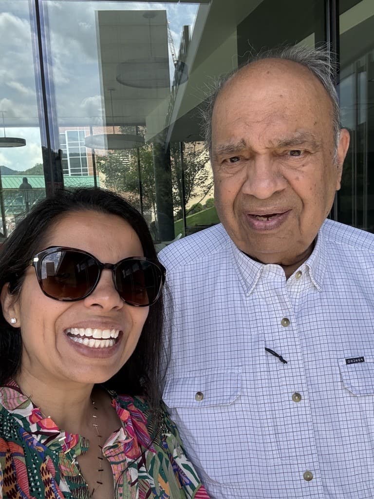 Mamata and her father smiling together